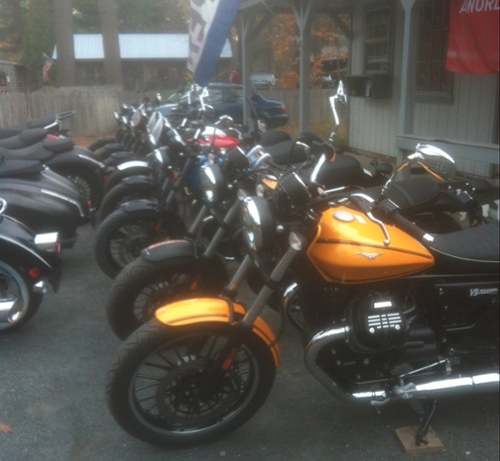 motorcycles lined up in garage